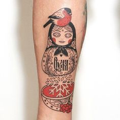 a woman with a bird on her head and snowflakes around her legs is depicted in this tattoo design