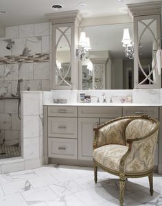 a fancy bathroom with marble floors and walls