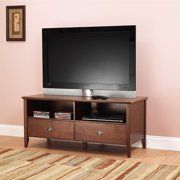 a flat screen tv sitting on top of a wooden entertainment center in a living room