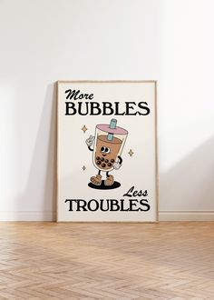 there is a sign that says more bubbles less troubles on the wall next to a wooden floor