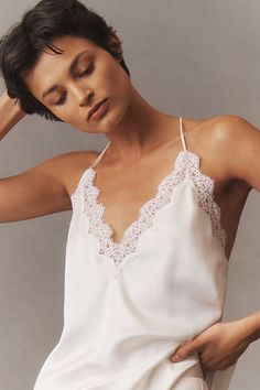 The Cami NYC Everly Silk Lace Cami exudes timeless elegance with its luxurious silk fabric and delicate lace detailing, offering a versatile and effortlessly chic addition to any wardrobe. | Everly Silk Lace Cami by Cami NYC in White, Women's, Size: Largearge at Anthropologie Elegant White V-neck Lace Top, Feminine White Silk Camisole, Elegant Sleeveless Camisole With Contrast Lace, Feminine Delicate Lace Camisole For Wedding Night, Chic Delicate Lace Camisole, Elegant White Lace Top With Delicate Straps, Wedding V-neck Camisole With Lace Trim, Wedding V-neck Lace Trim Camisole, Chic Silk Camisole With Lace Trim