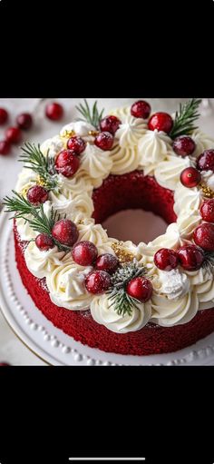 a red velvet cake with white frosting and cranberry toppings on top