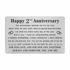 a metal plaque with the words happy 2nd anniversary written in black and white on it