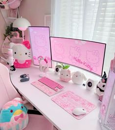 a desk with two computer monitors, keyboard and mouse on it in a pink room