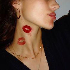 a woman with red lipstick on her face