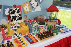 a table topped with lots of cakes and desserts