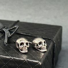 These unisex silver skull studs are a must-have! With intricate designs and a touch of coolness, they make an ideal gift for those who love rock music or embrace the Gothic-Punk-Tattoo fashion. Perfect for any occasion, and great for anyone looking to add some edge to their outfit. And let's not forget about all the avid skull jewelry collectors out there! Don't just take it from me, these earrings are sure to please anyone who receives or wears them. They're a practical and unique gift that will be treasured and worn with pride. Material: BrassType: Stud EarringsColor: Silver/BlackSize: One Size11x8mm(0.43x0.32in)_________________________ • GET IT FAST!Get it fast! Ready to ship on 1 to 3 business days. • ORDER NOW!Limited Quantities / Limited Edition. Thank you for stopping by!__________