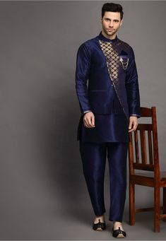 Art Silk Kurta in Navy Blue This Readymade attire is Enhanced with Buttons. Crafted in Chinese Collar Neck and Full Sleeve Available with an Art Silk Pajama in Navy Blue and an Art Brocade Silk Nehru Jacket in Navy Blue Do note: Brooch and Footwear shown in the image is for presentation purposes only. Half to one inch may vary in measurement. (Slight variation in actual color vs. image is possible) Royal Kurta With Zari Work For Festive Occasions, Royal Festive Kurta With Zari Work, Festive Royal Kurta With Zari Work, Royal Festive Kurta For Eid, Royal Blue Sherwani For Festive Occasions, Royal Blue Long Sleeve Sherwani, Blue Nehru Jacket For Diwali With Traditional Drape, Blue Traditional Drape Nehru Jacket For Diwali, Royal Blue Bandhgala For Festive Occasions