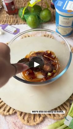 a person is cutting up food in a bowl