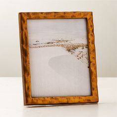 Handcrafted with a traditional sand-casting technique, metal picture frame features an organic silhouette full of raw, rough-hewn character. Adds an elegant vintage feel to the bedroom or entryway. Pair with the Abel mirror for a coordinated look. CB2 exclusive.Due to the nature of the material, brass patina will vary in color and darken over time.  -Handmade -Sand-cast aluminum frame -Sawtooth hangers for wall display -Easel back for tabletop display -Variations in texture and finish are to be Marble Pictures, Metal Picture Frame, Brass Picture Frames, Display Easel, Brass Patina, Metal Picture Frames, Tabletop Display, Sand Casting, Big House