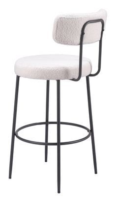 an upholstered chair with black metal legs and a white fabric seat pad on the back