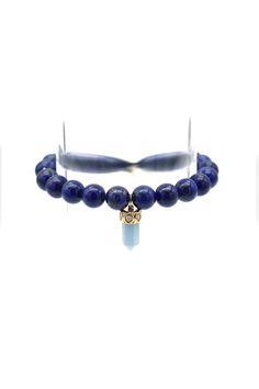 The Short Carved Stone Point Crystal charm features a 14K Yellow Gold cap with Diamonds. The smooth, round beads of the bracelet are made from deep blue Lapis. Slip-on style. Charm dimensions: 0.625"H x 0.25"W Blue Faceted Rondelle Bracelets, Sapphire Lapis Lazuli Bracelets With Round Beads, Blue Round Spiritual Charm Bracelet, Polished Beads Lapis Lazuli Round Bracelets, Lapis Lazuli Beaded Bracelets With Polished Round Beads, Polished Beads Lapis Lazuli Bracelets, Round Lapis Lazuli Bracelets With Polished Beads, Blue Gemstone Bracelets With Round Beads, Sapphire Jewelry With 8mm Beads