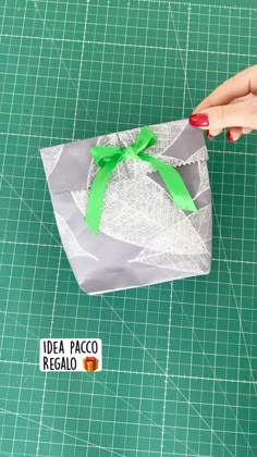 someone is making an origami bag out of paper