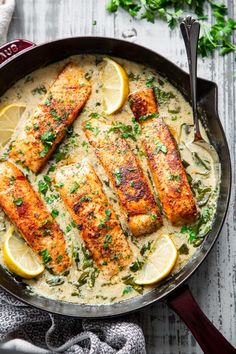 fish with lemon and parsley sauce in a skillet