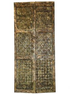 an old wooden door with intricate designs on it