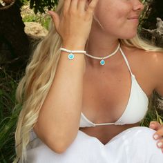 Say hello to endless summer vibes with our Sun Bleached Beaded Choker! This cool and breezy choker features stunning white puka shell beads, bringing that laid-back, sun-kissed beach feel to any outfit. The crisp white shells evoke memories of sandy shores and lazy days under the sun, making it a must-have for any beach lover. Lightweight and super comfy, the Sun Bleached Beaded Choker is perfect for everyday wear, whether you're heading to a beach party or just want to add a touch of coastal charm to your style. Pair it with our other beachy accessories for a complete sun-soaked look! - 14" beaded choker length + 2" extender chain - 4mm white rondelle puka shell beads - Lobster clasp closure with brand tag - Features a small Aqua / White St. Christopher Beachy Accessories, White Shells, Sandy Shores, St Christopher, Puka Shell, Coastal Charm, Beach Lover, Lazy Days, Beach Lovers