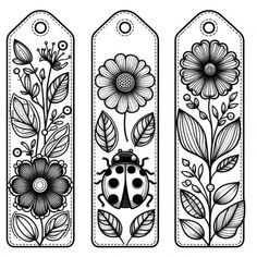 three tags with flowers and ladybug on them, one is black and white