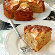 two plates with cakes on them, one has a fork in it and the other has a piece missing