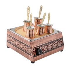 four candles are sitting on top of a tray