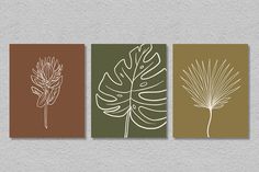 three different types of wall art with leaves on the bottom and one is brown, white and