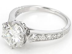 a white gold engagement ring with diamonds on the side