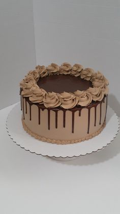 a cake with chocolate icing and flowers on top