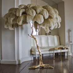 an ostrich feather tree in a living room