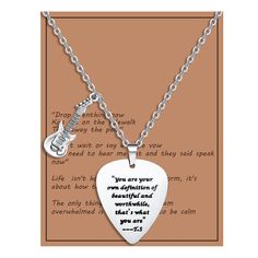 a guitar picker necklace with a poem on it