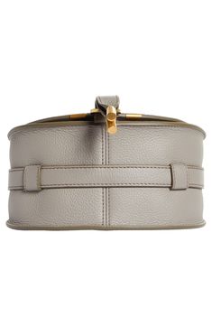 Curvaceous detailing and gleaming hardware ornament the saddle-shaped flap of a crossbody bag crafted from sumptuous grained leather in a compact silhouette. Front flap closure Adjustable crossbody strap Exterior slip pocket beneath flap Interior card slot Textile lining Leather Made in Italy or Spain Designer Handbags This brand has B Corp certification, representing business practices with emphasis on social and environmental performance, accountability and transparency This brand meets Nordst Luxury Saddle Bag With Detachable Strap And Top Handle, Luxury Leather Saddle Bag With Palladium Hardware, Luxury Saddle Bag With Detachable Strap For Office, Luxury Office Saddle Bag With Detachable Strap, Designer Saddle Bag With Gold-tone Hardware And Top Handle, Luxury Saddle Bag With Silver-tone Hardware, Top Handle Belt Bag With Detachable Strap, Elegant Satchel Belt Bag For Office, Luxury Crossbody Saddle Bag With Silver-tone Hardware