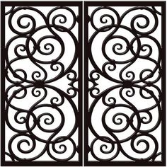 an iron gate with swirly designs on the top and bottom, is shown in black