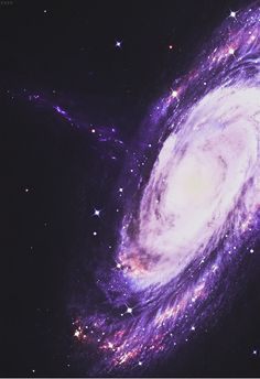 an image of a spiral galaxy with stars in the night sky, taken from above