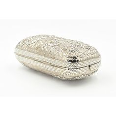 Elegant Judith Leiber silver metal and crystal oblong evening bag clutch featuring a scrolling foliage flower design on a silver - toned metal bag.  The hardware is silver.  It has a silver leather interior with a silver shoulder strap that can be folded inside when you want to wear it as a clutch.  There is a circle that folds out to hold a tassel, but it is no longer there.  Labeled ‘Judith Leiber/New York’ in the interior. 5.5” W x 3” H x 1.5” D  A similar one sold at Chrisities from Joan Riv Designer Silver Clutch With Silver-tone Hardware, Silver Evening Bag With Rectangular Case Shape, Silver Evening Bag Rectangular Case, Designer Rectangular Case Evening Bag, Designer Silver Clutch As A Gift, Designer Silver Clutch For Formal Events, Designer Silver Clutch For Formal Occasions, Luxury Formal Clutch With Silver-tone Hardware, Designer Silver Clutch For Events