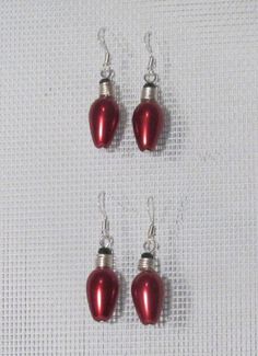 "22 inches long. This necklace has the 'chunky' look. Large Red Glass Beads with Clear AB crystals and Black bead caps. Each end has a 5 1/2\" length of Double layer Black chains. Closure is a decorative Black Toggle Clasp. I can change the length to fit you. The set includes a pair of matching dangle earrings. #18682" Red Jewelry For Holiday Jewelry Making, Holiday Red Nickel-free Jewelry, Red Beaded Jewelry For Holiday, Pearl Christmas Tree, Christmas Tree Light Bulbs, Pearl Christmas, Christmas Tree Light, Tree Light, Light Earrings