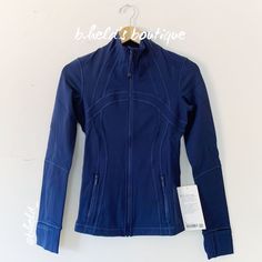 Description: Lululemon Define Jacket *Luon In Mineral Blue (Minb). Beautiful Deep Blue Color. Released In May 2022. Discontinued Color. Special Collector’s Item. Has An Elastic Zipper Pull (Or Hair Tie) Attached To The Front Zipper. Up For Adventure. And Ready For Downtime. Made From Cottony-Soft Luon Fabric. Zippered Pockets. Has Thumbholes & Cuffins. Slim Fit, Hip Length. Sold Out. Size: Size 4 Condition: Brand New With Tags (Nwt). Never Worn! Authentic Lululemon Purchased Directly From The Lu Functional Blue Outerwear For Workout, Navy Fitted Sports Outerwear, Fitted Navy Sports Outerwear, Blue Stretch Athleisure Outerwear, Blue Track Jacket For Gym In Fall, Blue Winter Gym Outerwear, Fitted Functional Blue Outerwear, Blue Winter Workout Track Jacket, Navy Long Sleeve Activewear For Workout