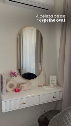 a white desk with a mirror and other items on it