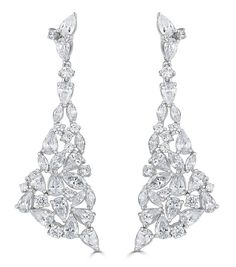 The Rita Statement Drop Earrings combine sparkling round and marquise cubic zirconia stones to create this beautiful statement earring. The earrings have just the right of movement to add sparkle and glamorous finishing touches to any outfit. Made to highest standard using fine jewelry making techniques.925 Sterling Silver | Rhodium PlatedHandset Marquise and Pear Cut Flawless CZ Premium Quality Grade 5A Cubic Zirconia 2 inches long Diamond Circle Necklace, Gold Bar Earrings, Wedding Earrings Drop, Minimal Earrings, Bar Stud Earrings, Bridal Engagement Rings, Statement Earring, Circle Diamond, Statement Drop Earrings