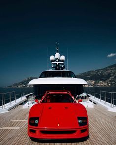 a red sports car parked on top of a boat