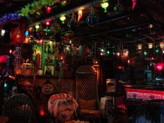 a room filled with lots of different colored lights and decorations on the wall above it