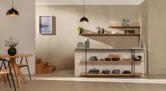 a dining room table and some chairs in front of a wall with shelves on it