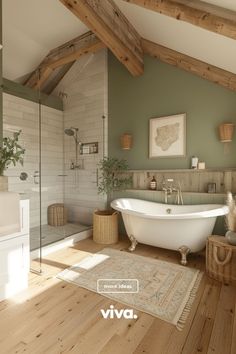 a bathroom with a tub, rug and wooden flooring in front of the bathtub