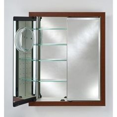 an open medicine cabinet with glass shelves and lights on the door, in front of a white wall