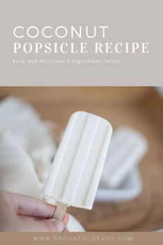 a person holding an ice cream popsicle in their hand with the title coconut popsicle recipe