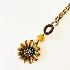 Sweet Summertime Sunflower Necklace features a bronze sunflower pendant with a yellow jasper bead. It hangs on a brass chain with lobster claw closure and you can choose your length at checkout. The sunflower pendant measures 25mm. It will come packaged and ready for gifting. Key Charm Necklace, Yellow Jasper, Sunflower Jewelry, Sunflower Pendant, Sunflower Necklace, Antique Keys, Sweet Summertime, Boho Style Jewelry, Boho Pendant