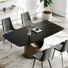 a black marble dining table with grey chairs and a potted plant in the corner