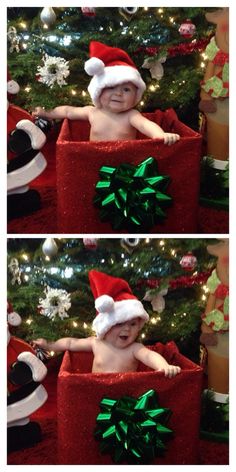 a baby wearing a santa hat sitting in front of a christmas tree