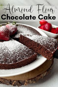 chocolate cake with powdered sugar and strawberries on top