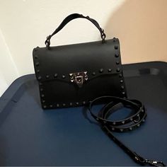 Brand New , Black Color, Metal Stud, It’s Like Rock Style . Comes With Crossbody Strap Black Edgy Bag With Detachable Strap, Edgy Black Bags With Detachable Strap, Edgy Black Shoulder Bag For Evening, Black Shoulder Bag With Gunmetal Hardware For Party, Trendy Black Shoulder Bag With Gunmetal Hardware, Black Shoulder Bag With Metal Hardware For Night Out, Black Party Bags With Gunmetal Hardware, Black Party Bag With Branded Hardware, Black Party Bags With Branded Hardware