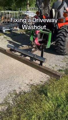 a tractor is parked next to a driveway with the words fixing a driveway washout