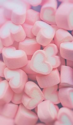 pink marshmallows are piled on top of each other