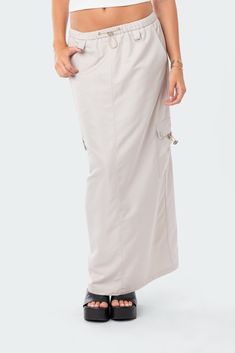 PRODUCT INFO Cargo Skirt Drawstring waistband Cargo pockets Polyester, Rayon Model wears size S Model height is 5'6 Item care: Wash with similar color Neutral Trousers, Knit Maxi Skirt, Tiered Maxi Skirt, Skirt Trends, Runway Trends, Swimwear Dress, Denim Maxi Skirt, Cargo Skirt, Nyc Fashion